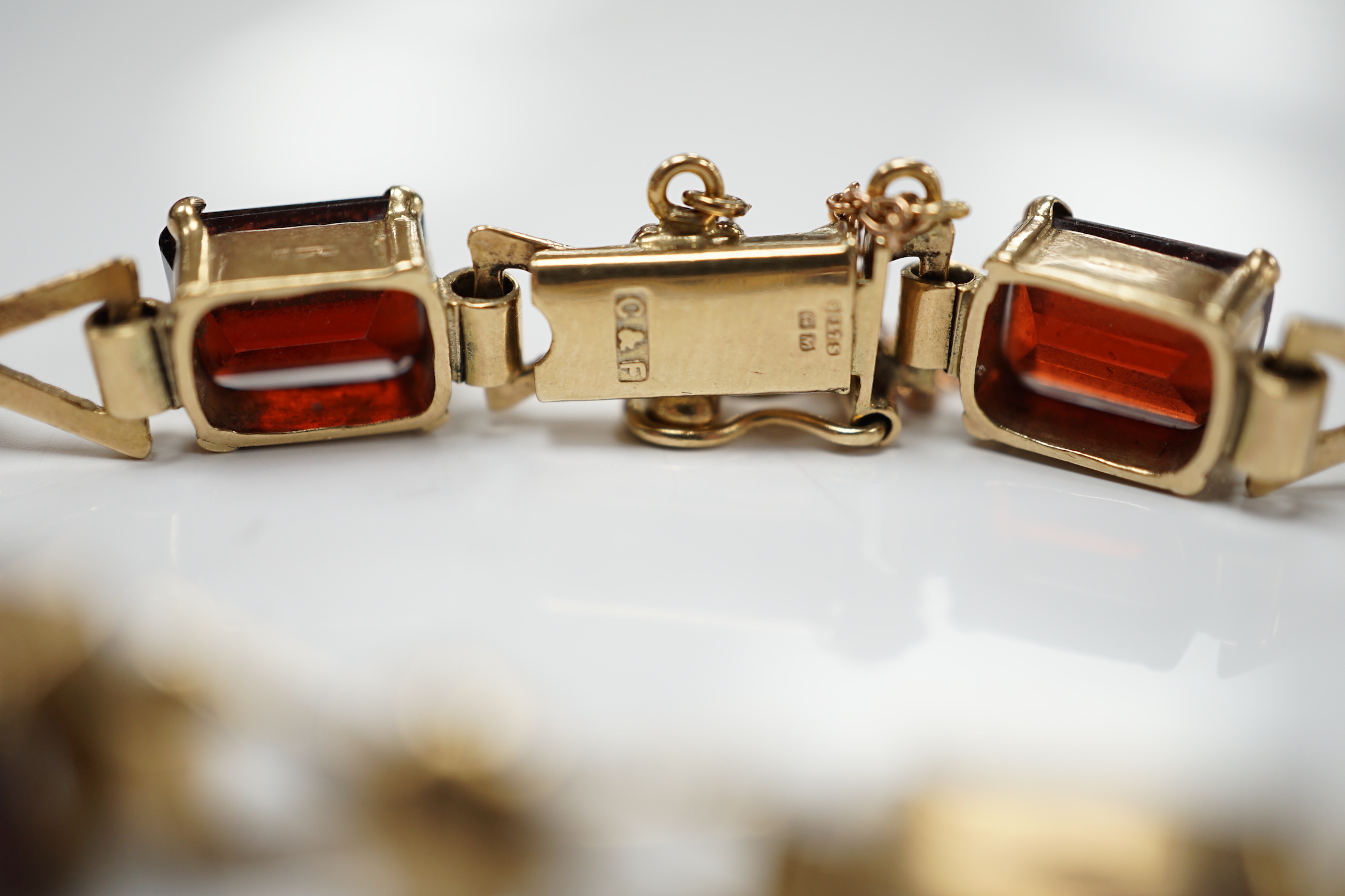 A 1960's 9ct gold and seven stone garnet set bracelet, by Cropp & Farr, 18cm, gross weight 17.9 grams.